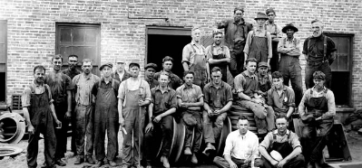 EJ 1920s employees standing in front of original foundry.jpg