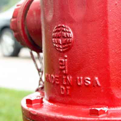 Red WaterMaster 5BR250 fire hydrant bonnet close up with EJ logo